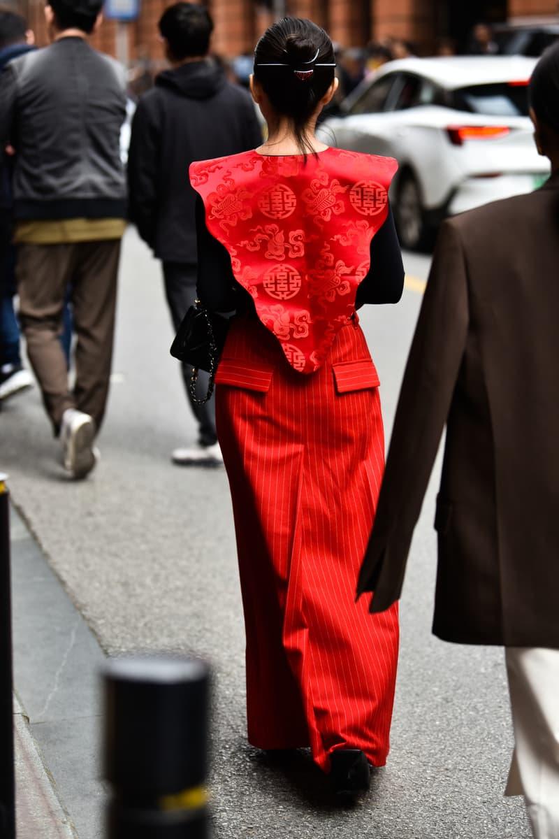 Woman in vivid red clothing walking on a contemporary Shanghai street